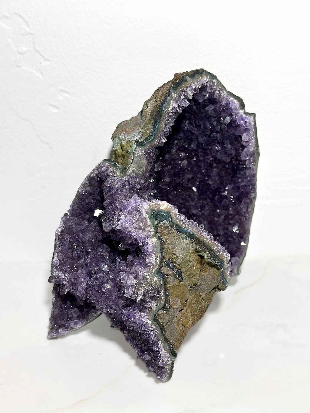 Amethyst cluster, front view showing its sparkling violet interior