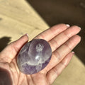 Smooth meditation stone of violet amethyst