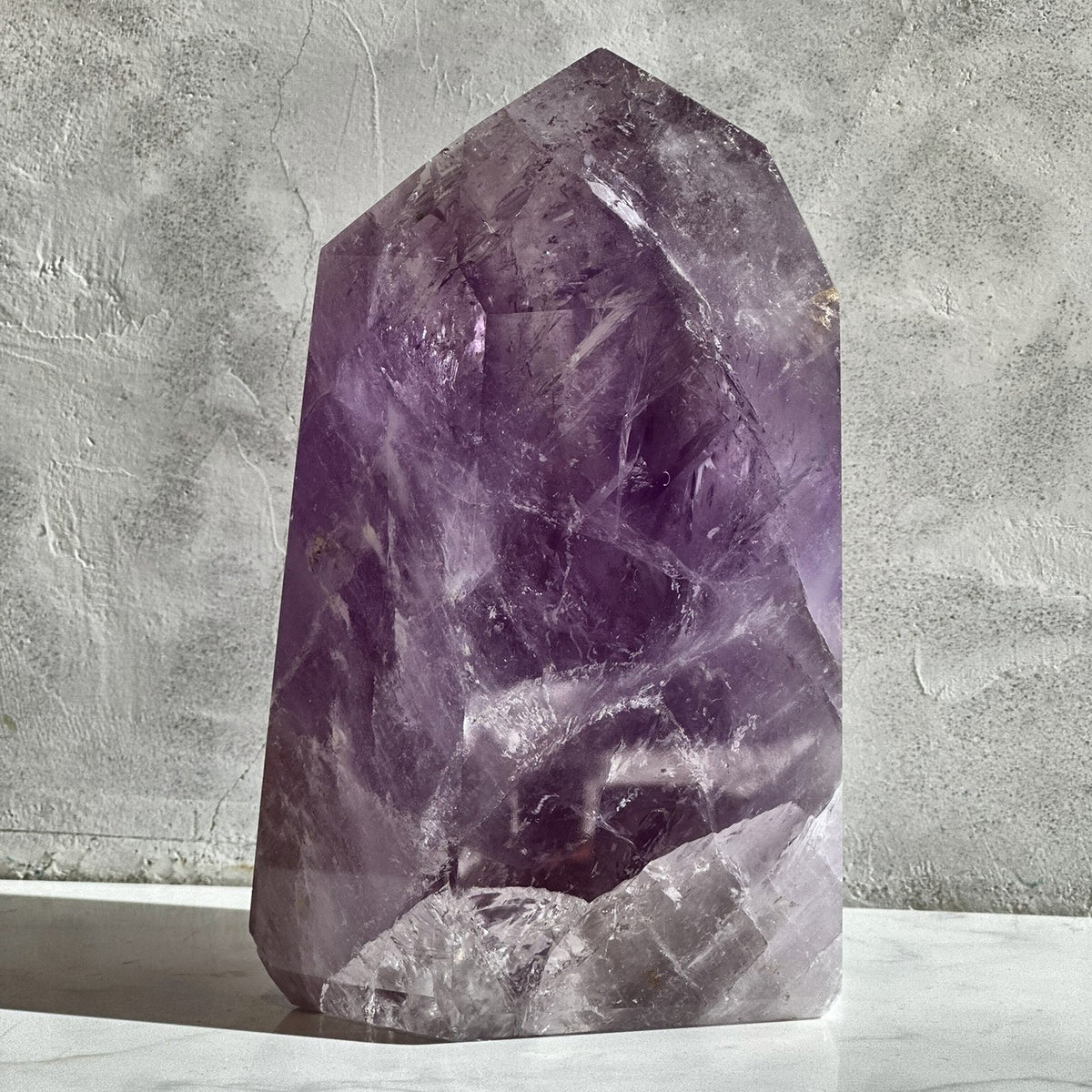 Polished tower of violet amethyst