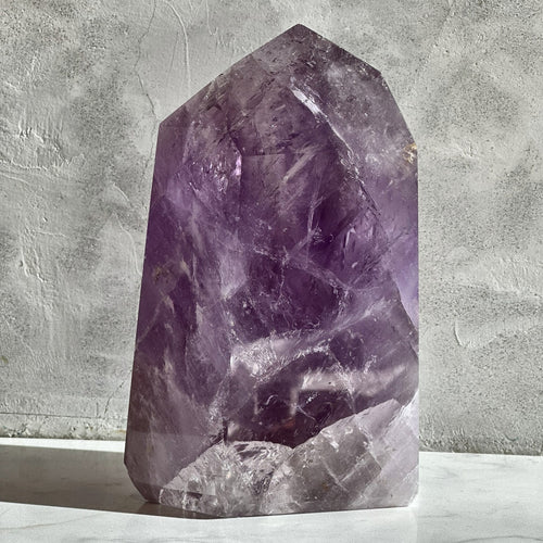 Polished tower of violet amethyst