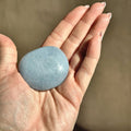 Smooth meditation stone of soft blue angelite