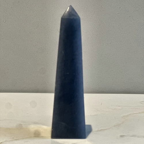 Polished point of soft blue angelite, second view