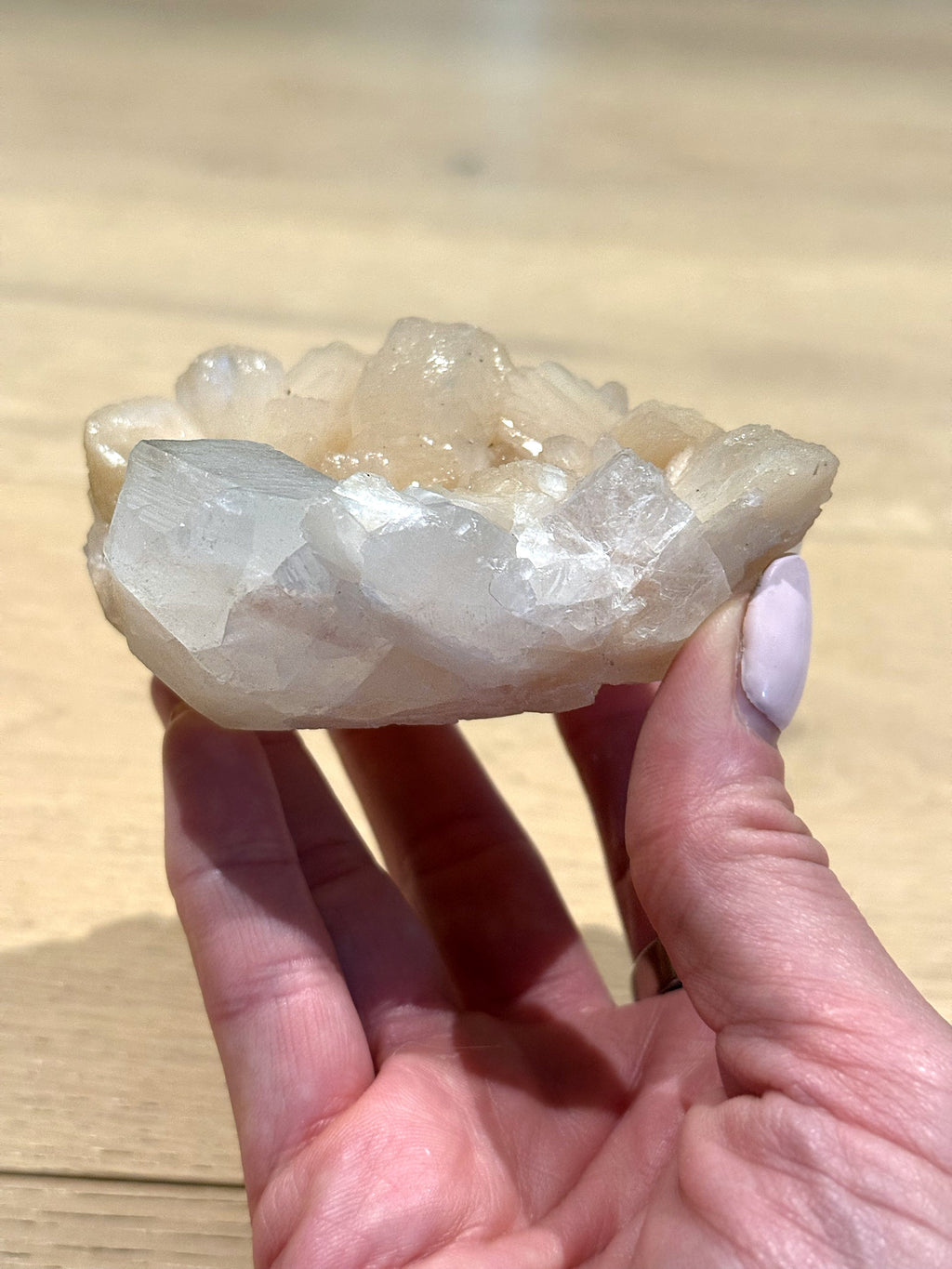 Side view of the apophyllite and peach stilbite cluster