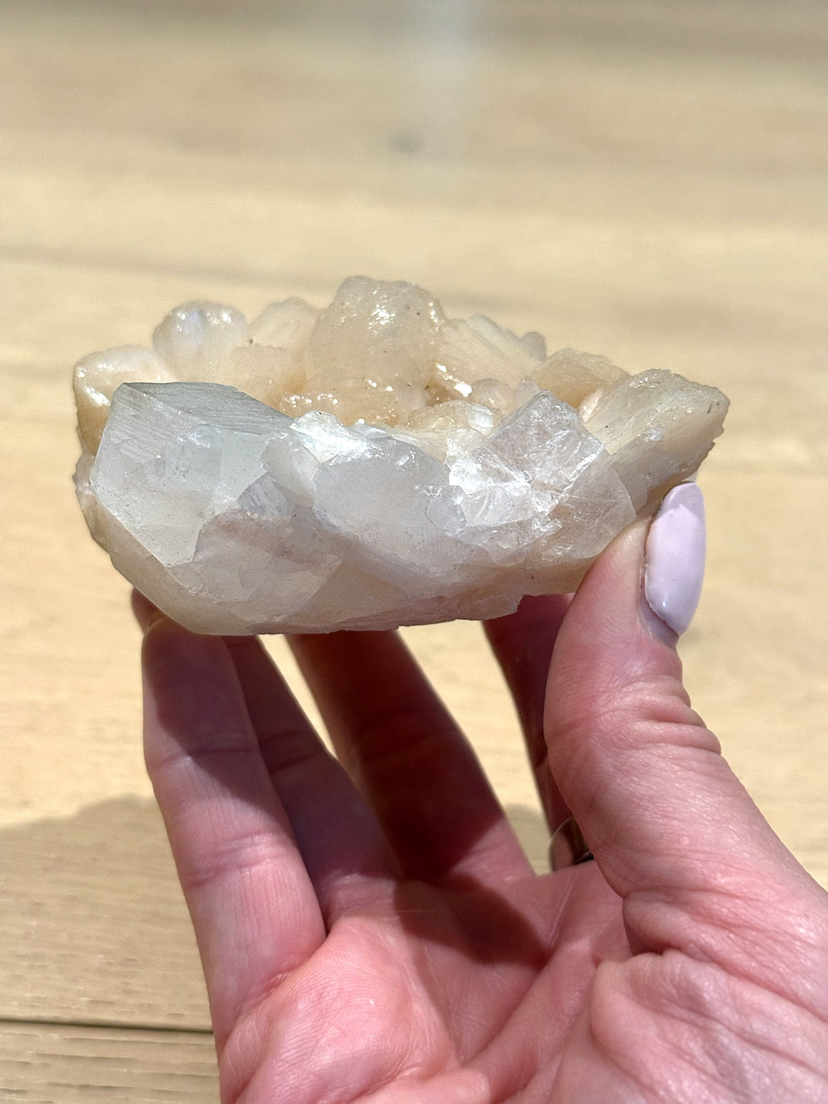 Side view of the apophyllite and peach stilbite cluster