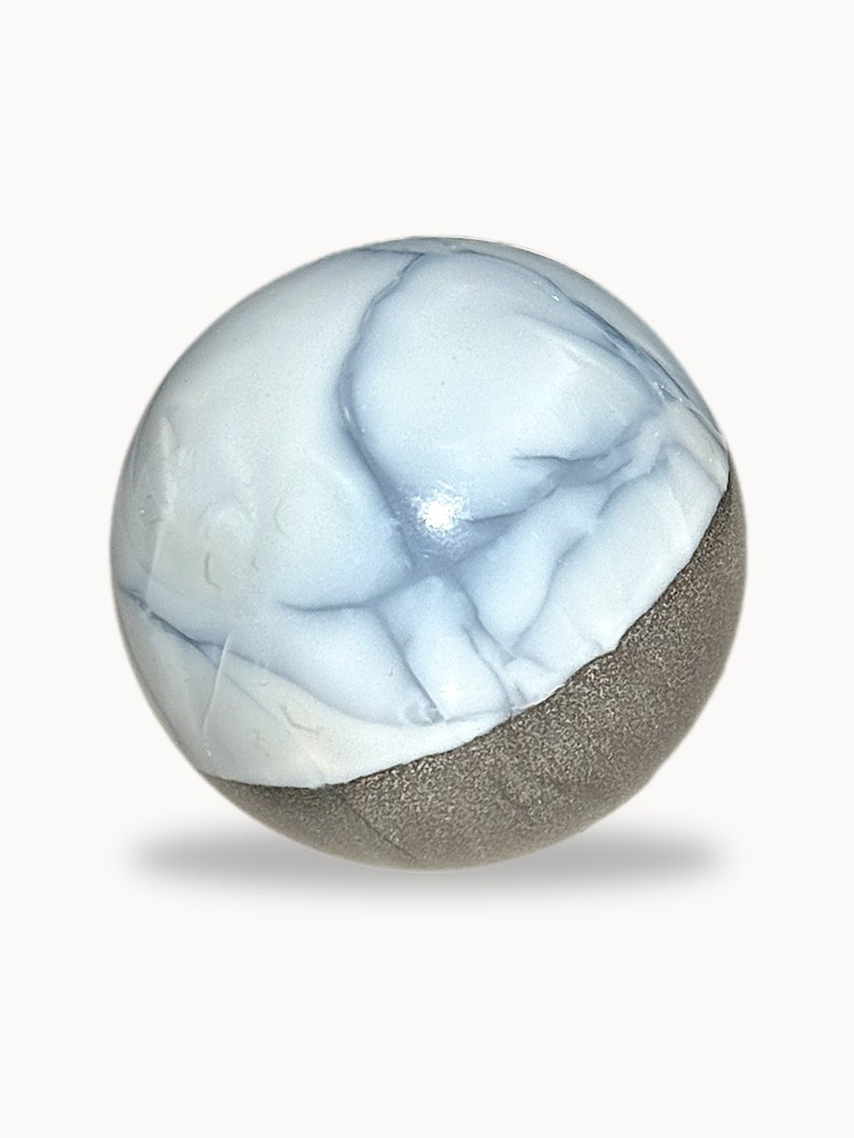 Small blue opal sphere with blue veins, close view
