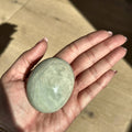 Smooth meditation stone of green moonstone