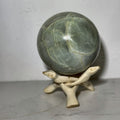 Small polished sphere of green moonstone from Madagascar