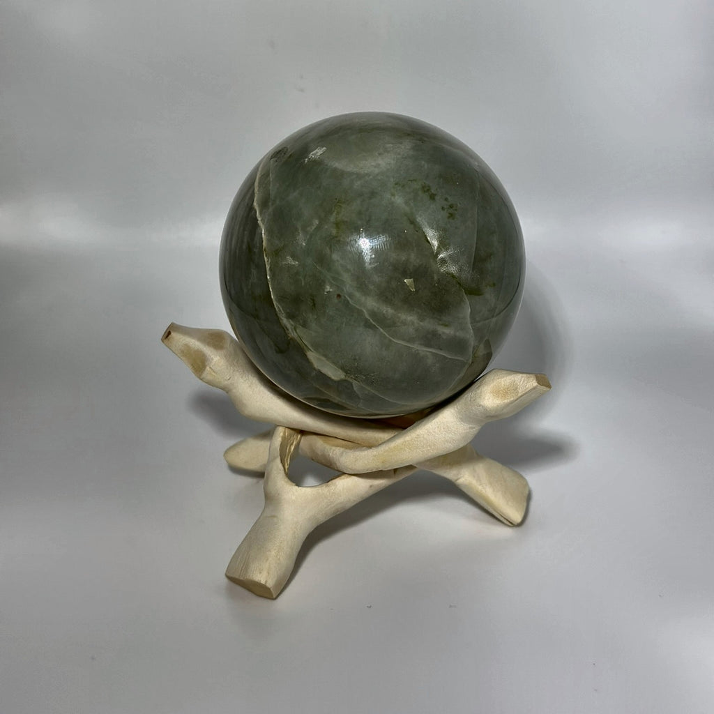 Small polished sphere of green moonstone from Madagascar, second view