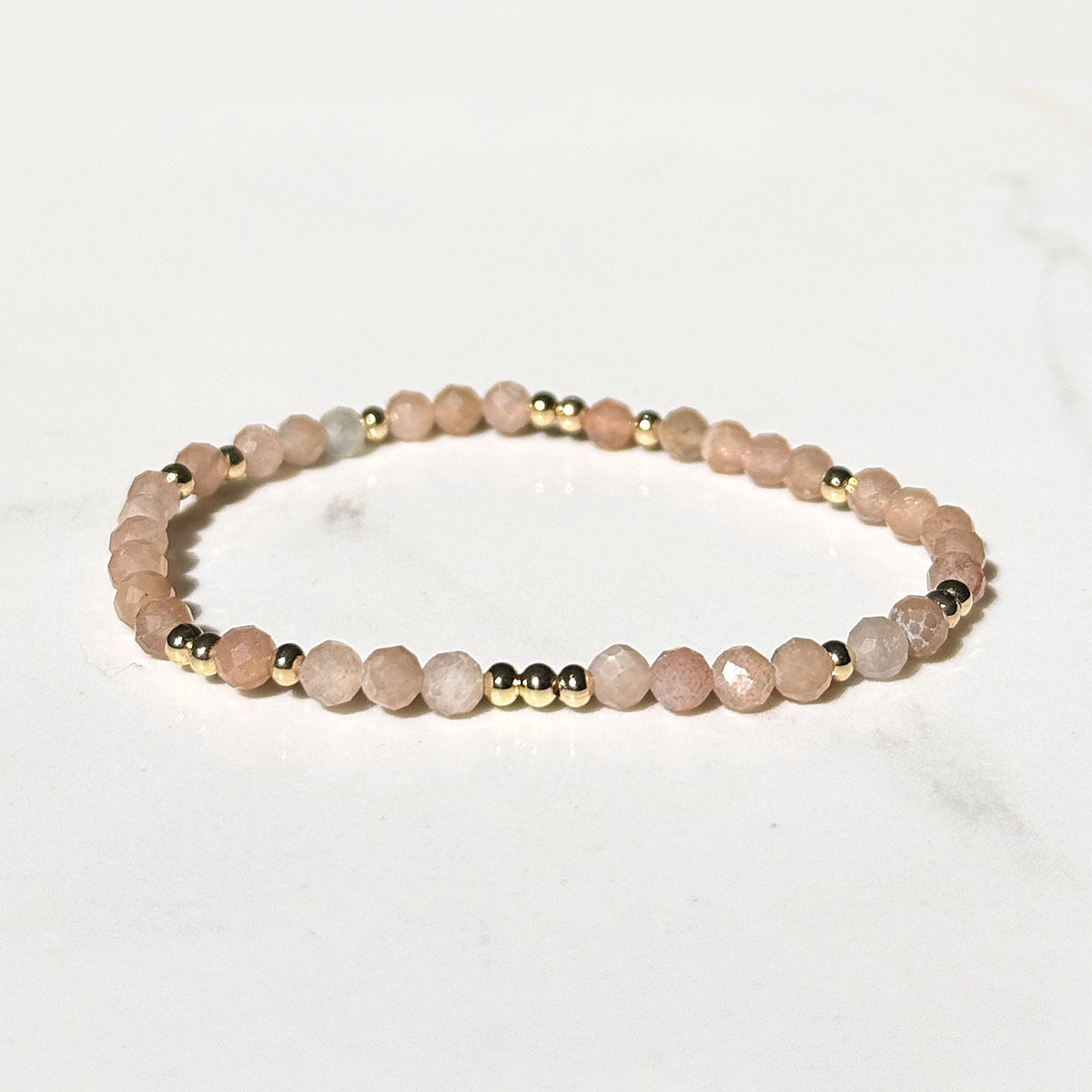Halo stretch bracelet in peach moonstone