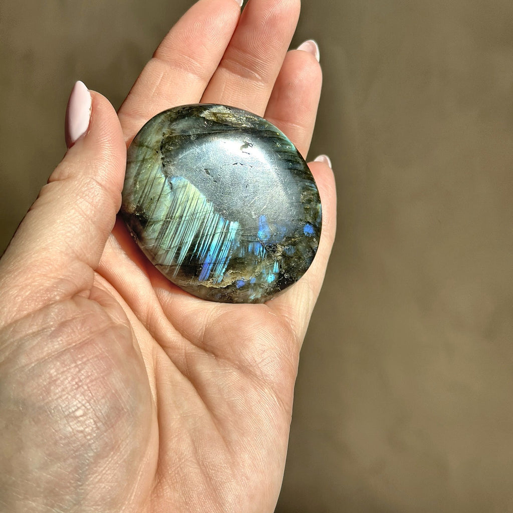 Smooth meditation stone of flashing labradorite