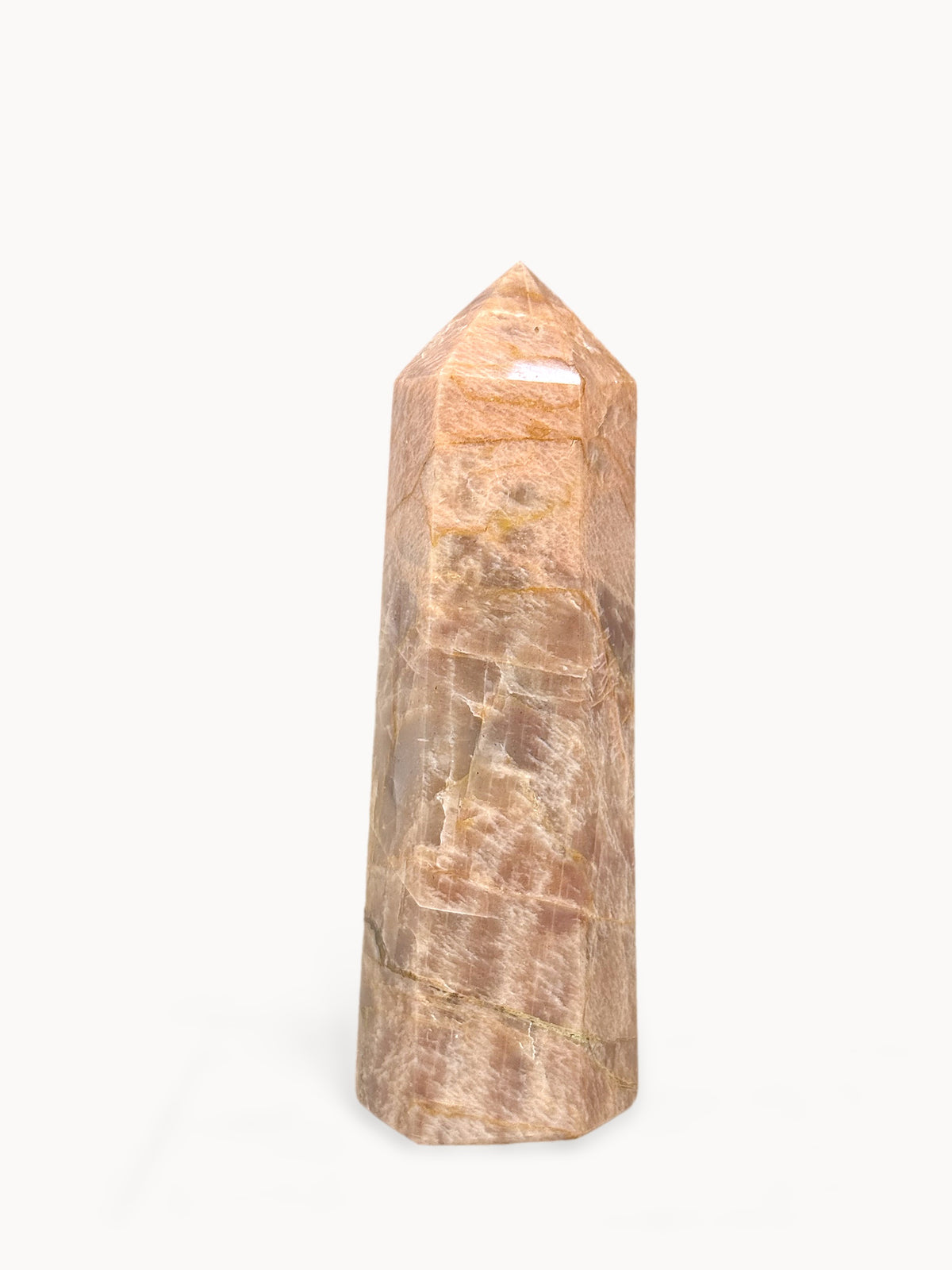 Polished peach moonstone tower, 6.5 inches tall, deep peach with golden veins