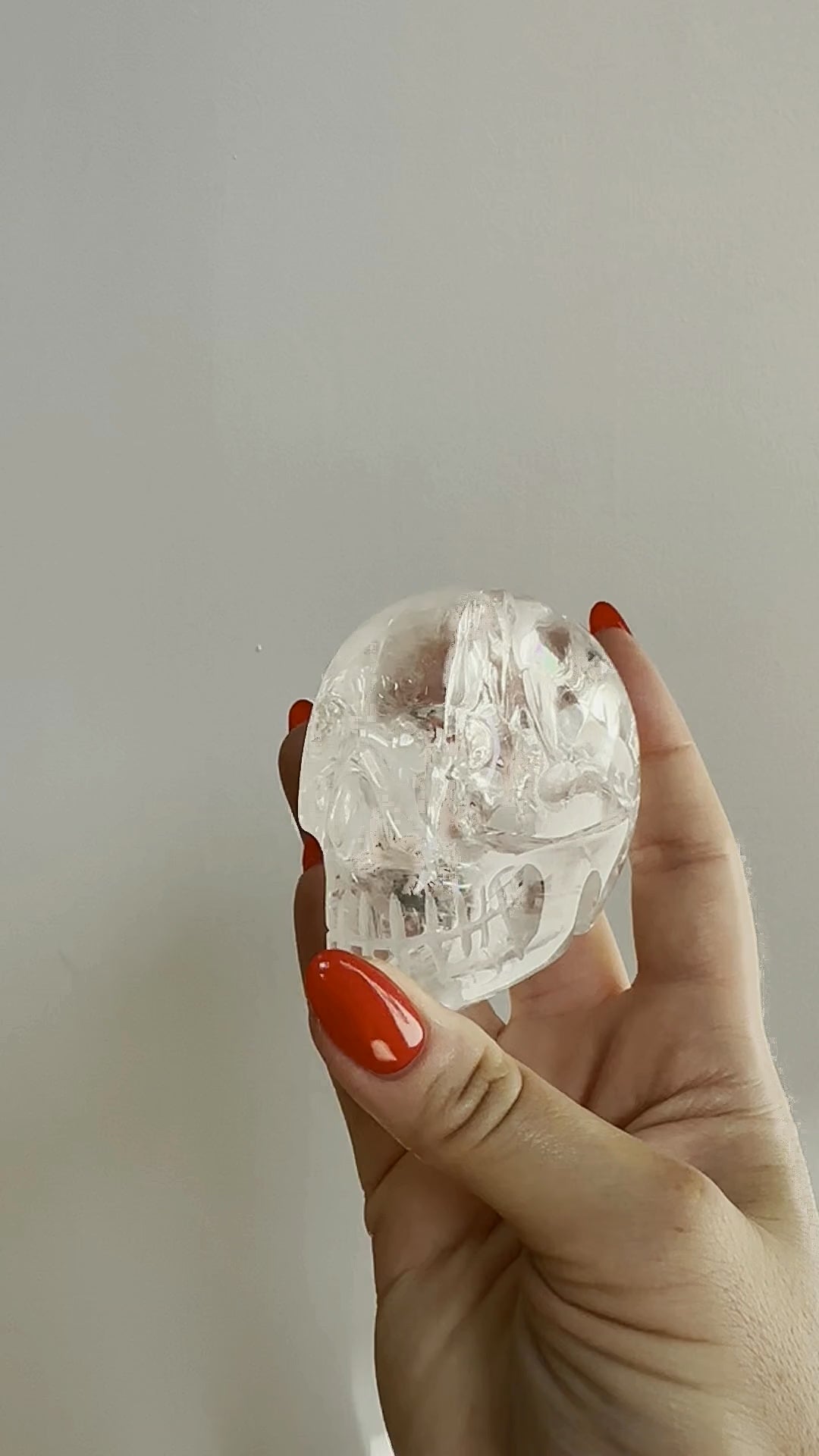 Clear quartz skull turning in the hand