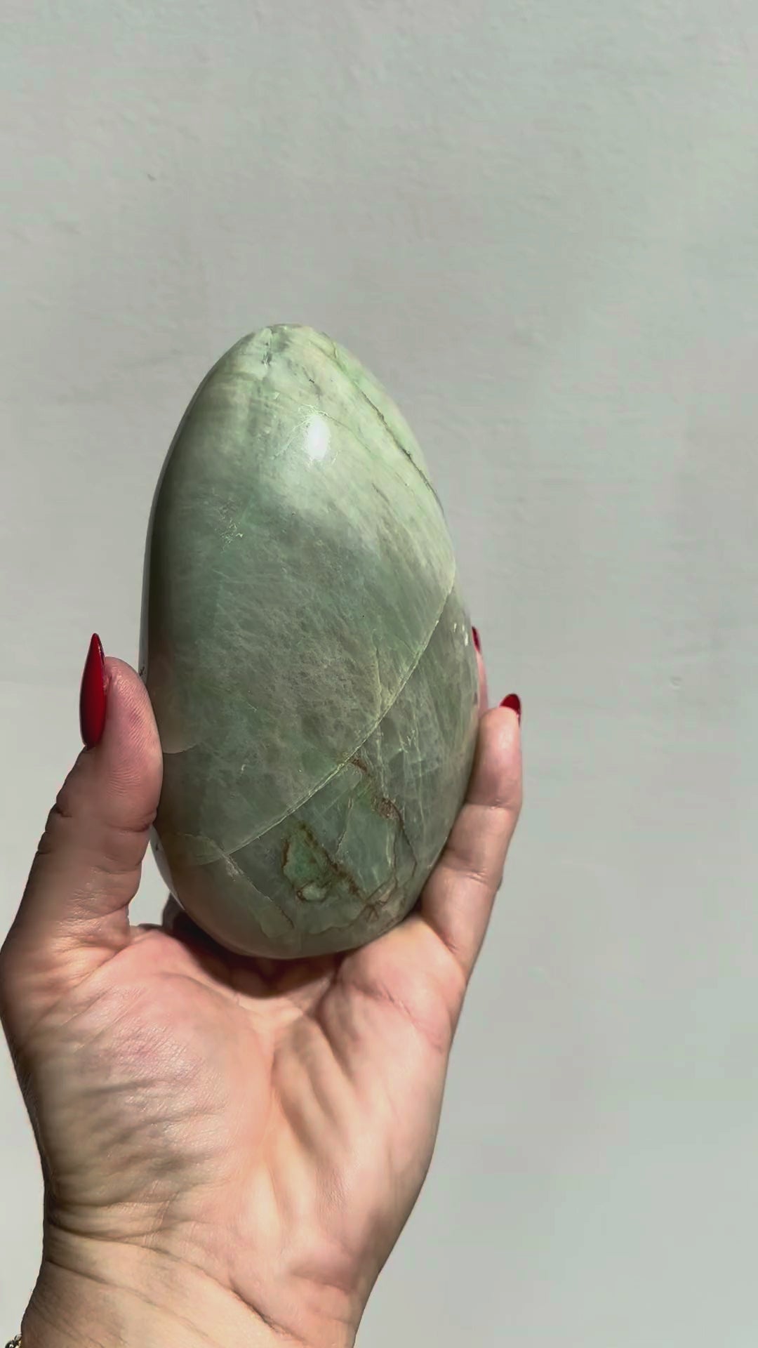 Green moonstone dome turning in the light