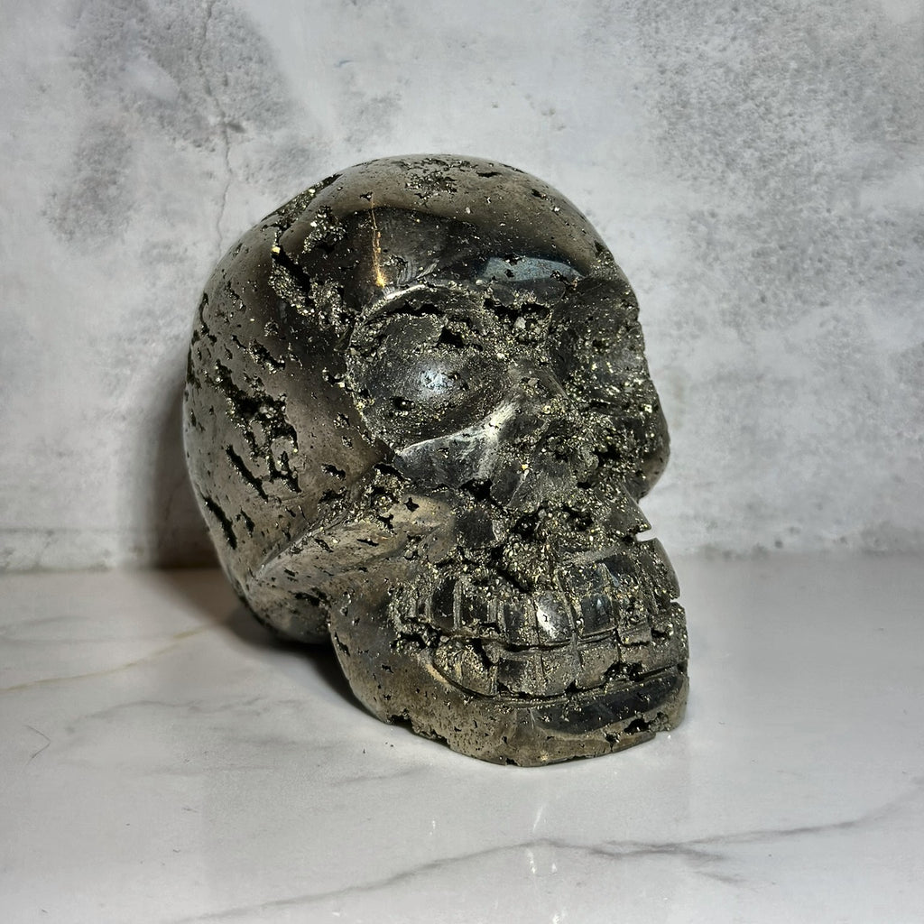 Hand-carved skull of golden pyrite from Peru