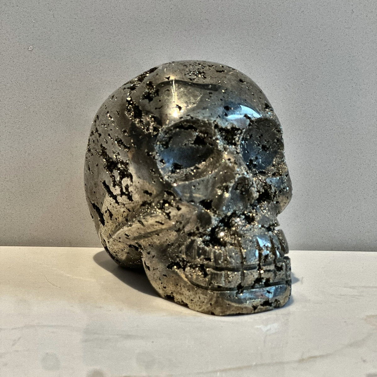 Hand-carved skull of golden pyrite from Peru, second view