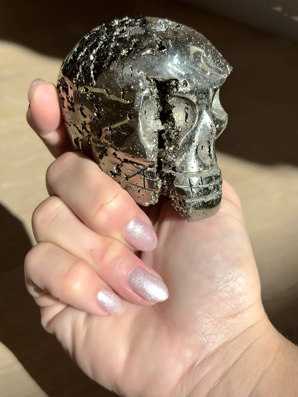 Pyrite skull No. 5 in hand, close view
