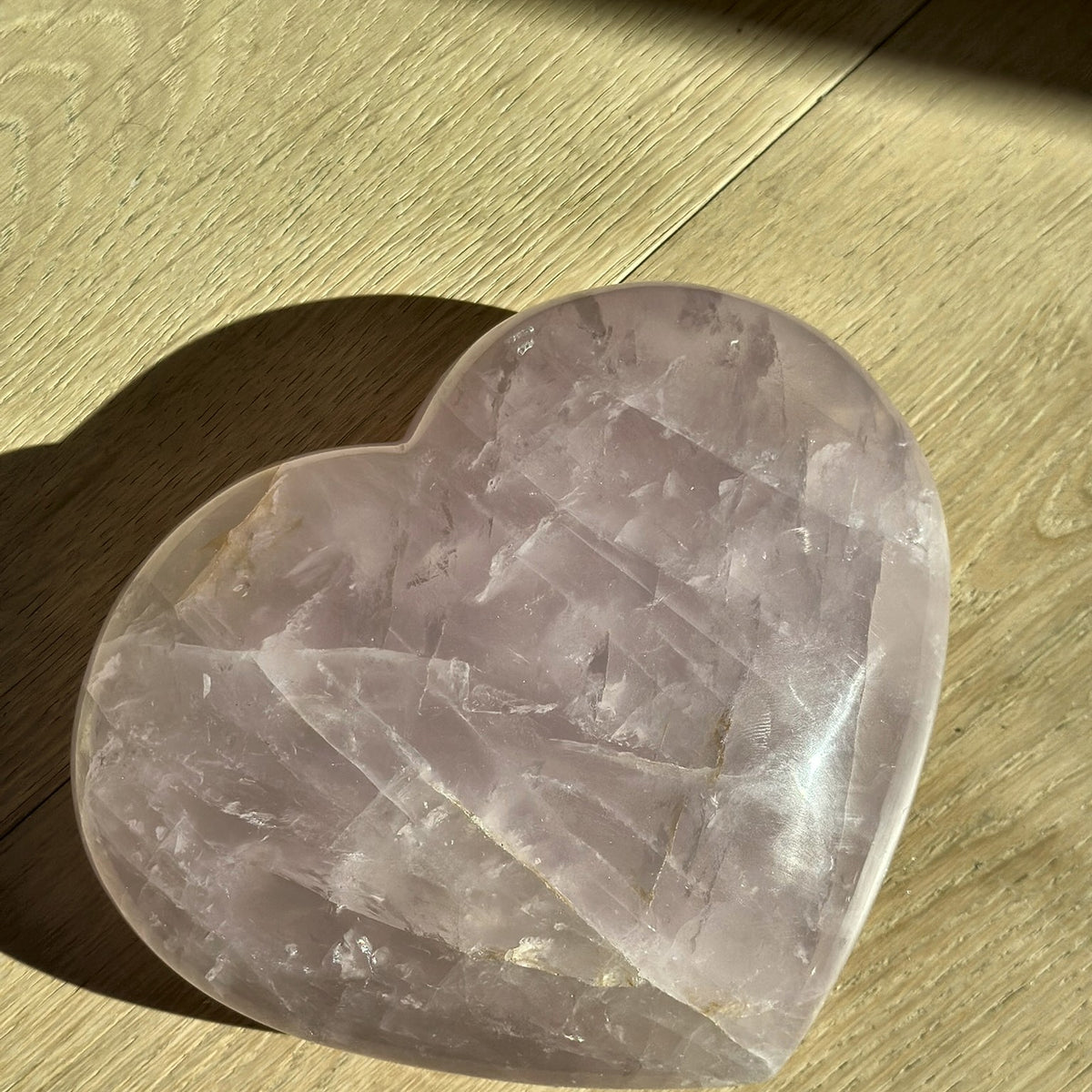 Large hand-carved heart of soft pink rose quartz from Madagascar