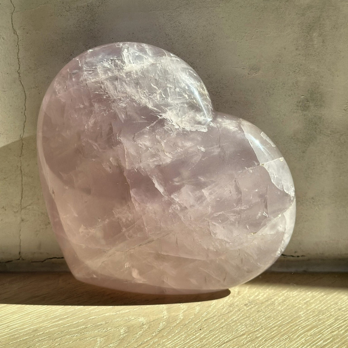 Large hand-carved heart of soft pink rose quartz from Madagascar, second view