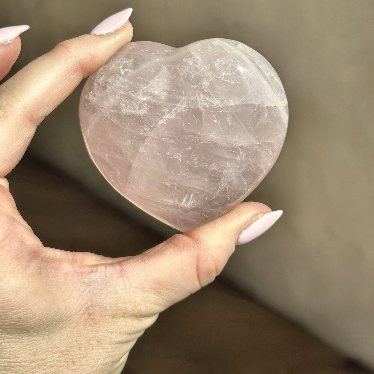 Small hand-carved heart of soft pink rose quartz from Madagascar