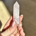 Polished point of soft pink rose quartz