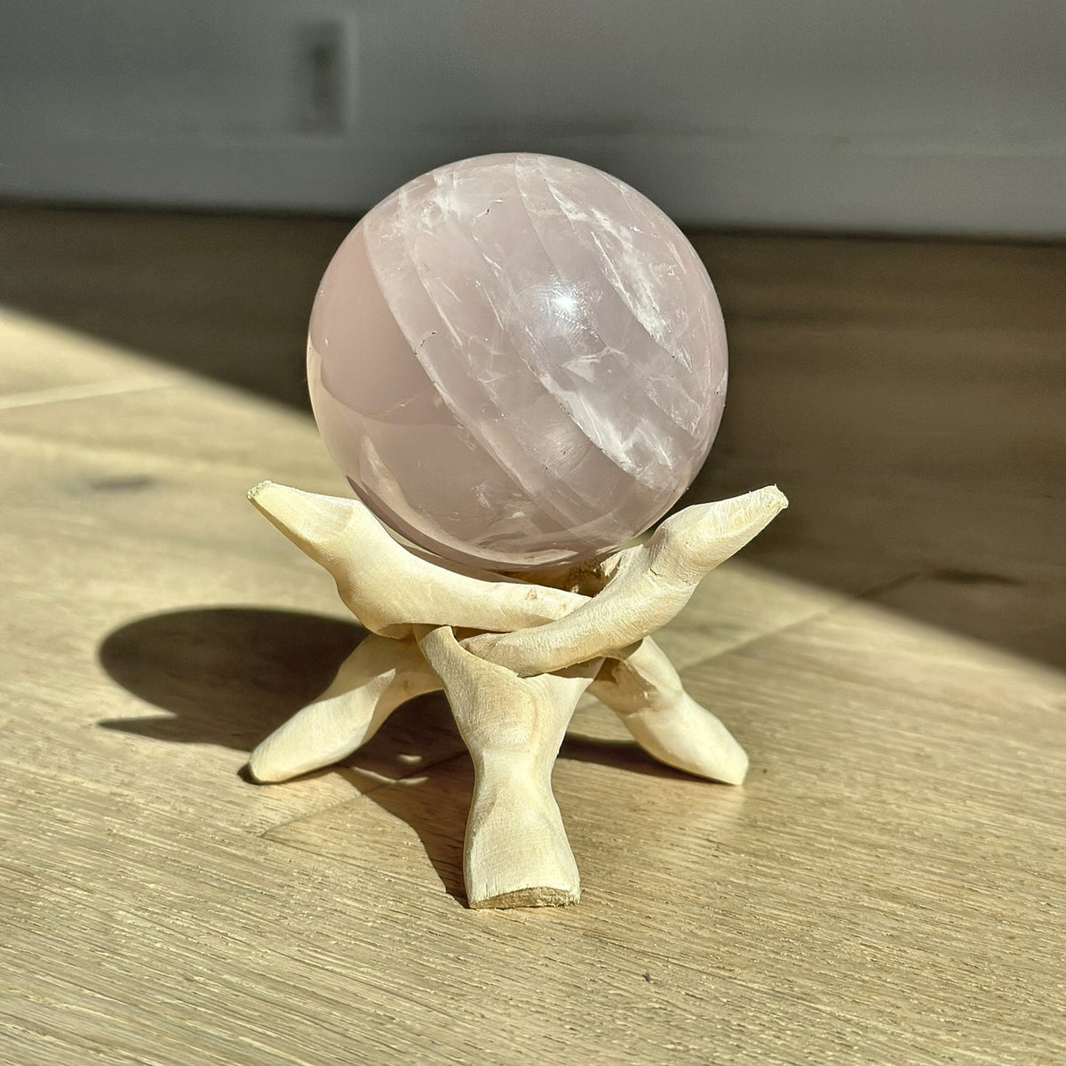 Large polished sphere of soft pink rose quartz from Madagascar