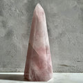 Polished tower of soft pink rose quartz from Madagascar