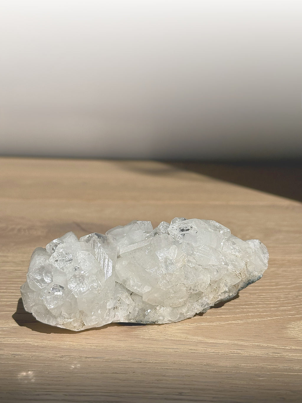 Side view of the long clear apophyllite cluster in sunlight