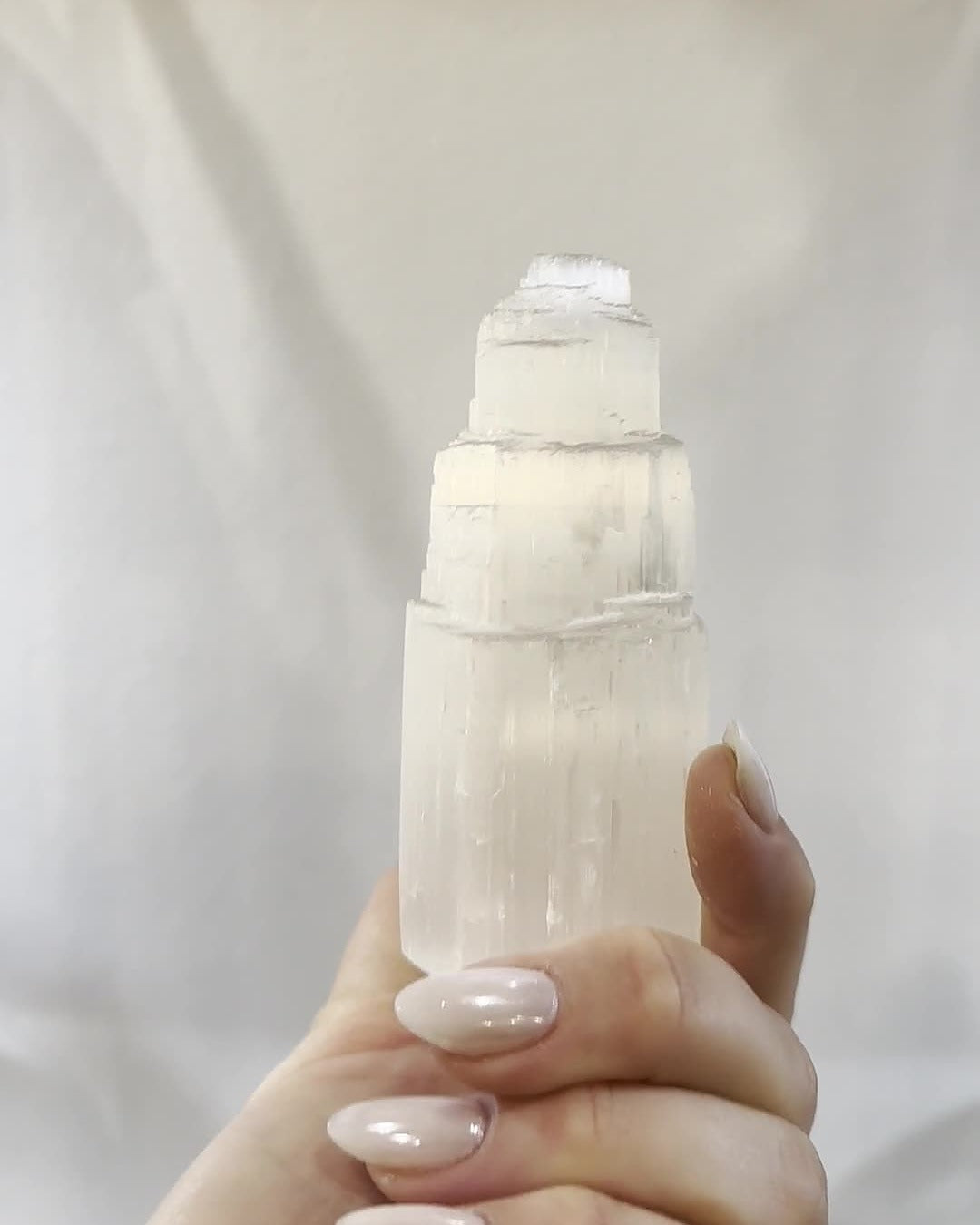 Selenite tower held up to the light