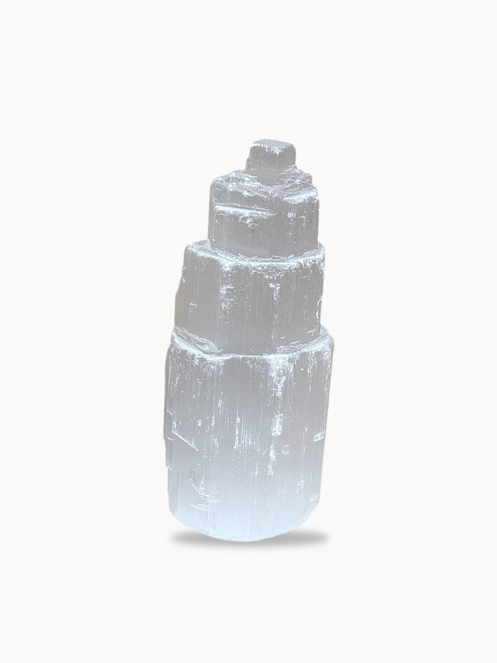 Stepped selenite tower on white