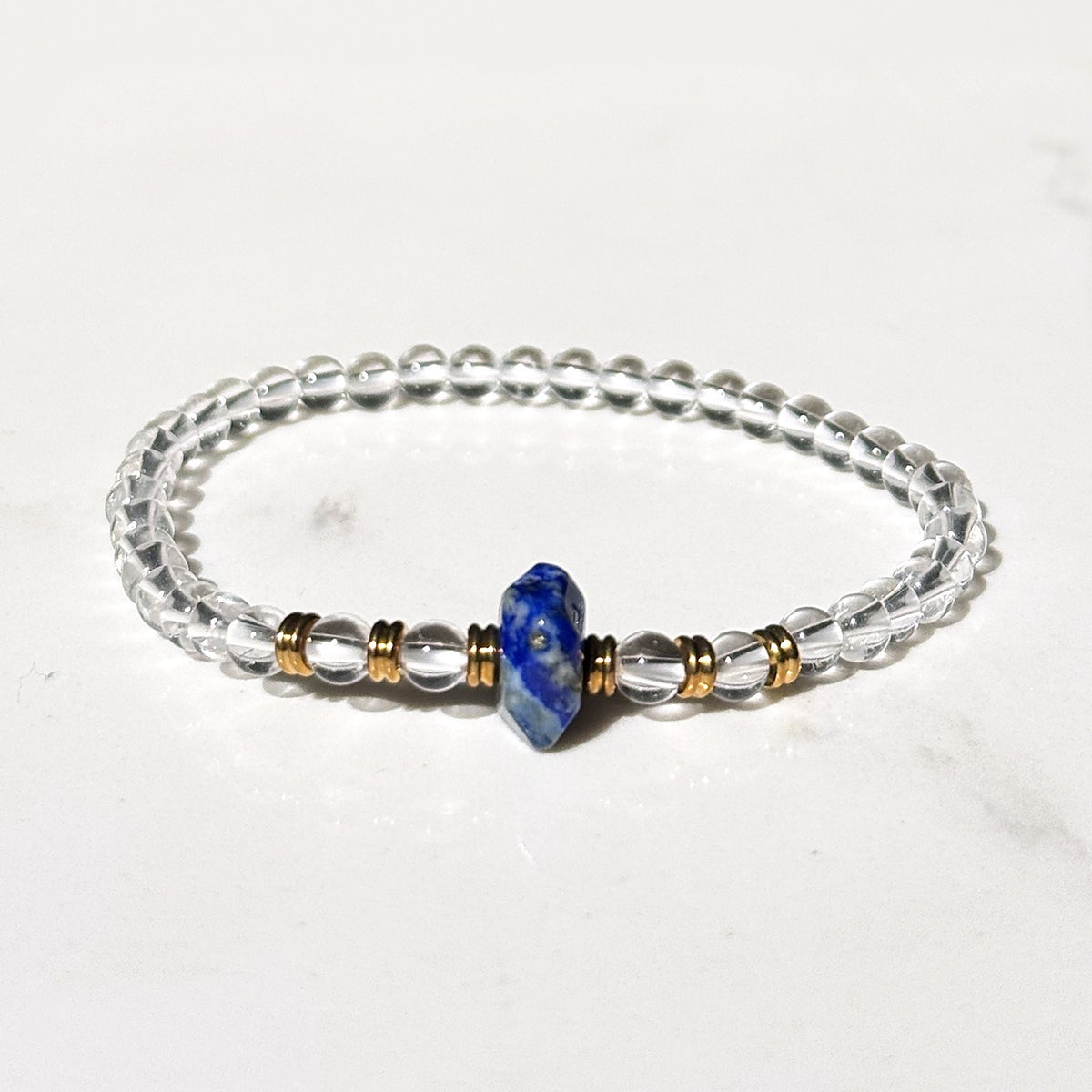 Wisdom stretch bracelet in clear quartz and lapis lazuli